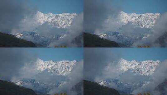 云雾下的雪山景观高清在线视频素材下载