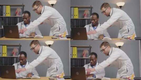 两名医生在实验室检查笔记本电脑屏幕高清在线视频素材下载