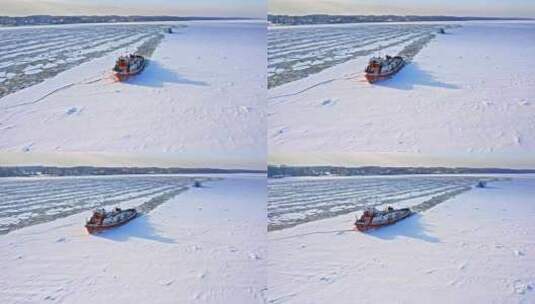 冬天河上的破冰船。冰冻河流的鸟瞰图。高清在线视频素材下载