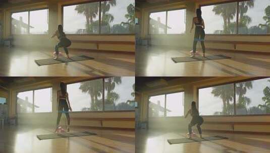 女人在健身房的垫子上训练注意力高清在线视频素材下载