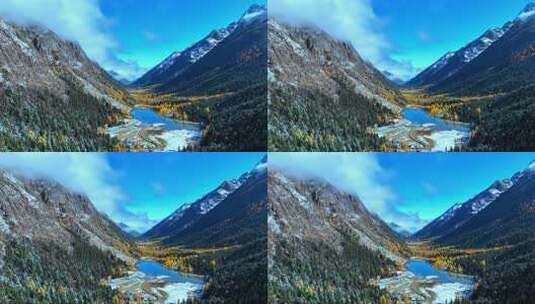 雪山下多彩树林与湖泊相映的美景高清在线视频素材下载