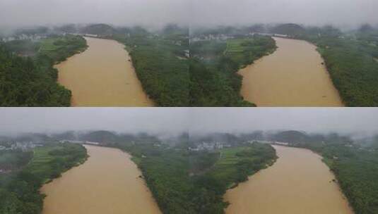 暴雨河流水位上涨河流两岸植被及建筑俯瞰高清在线视频素材下载