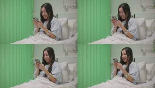 病人躺在病床上开心的玩手机高清在线视频素材下载