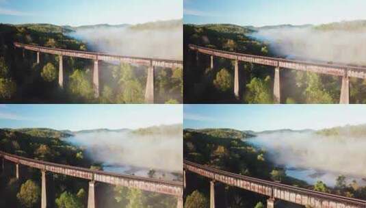 山脉雾中的钢铁铁路栈桥高清在线视频素材下载