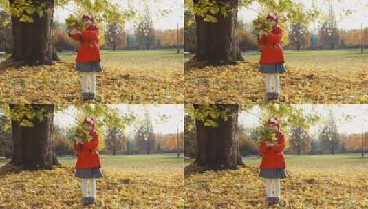 女孩拿着叶子在公园高清在线视频素材下载