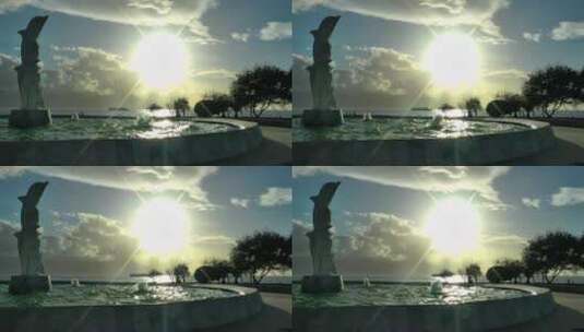 海滩喷泉中的海豚雕像高清在线视频素材下载