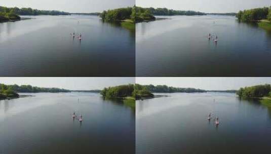 无人驾驶飞机观看河流上的划船者高清在线视频素材下载