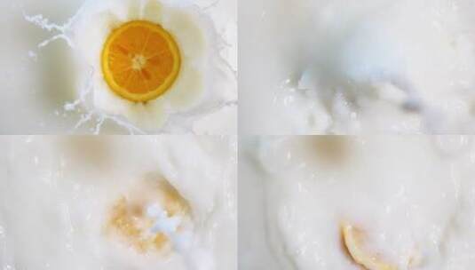 橘子片落入新鲜的牛奶中高清在线视频素材下载