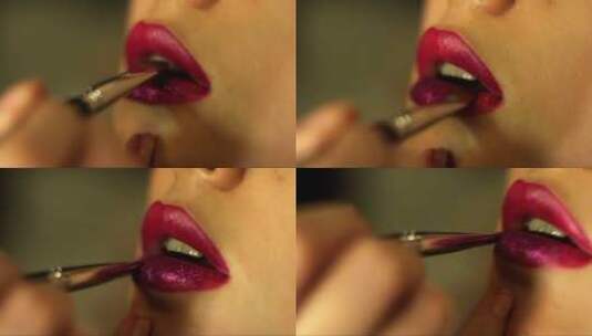 化妆师用刷子在客户的嘴唇上涂上紫色闪光高清在线视频素材下载