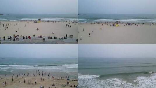 三亚市三亚湾大东海旅游区沙滩上的游客高清在线视频素材下载