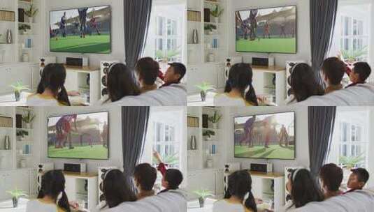 幸福的一家人坐在家里一起看电视上的曲棍球比赛高清在线视频素材下载