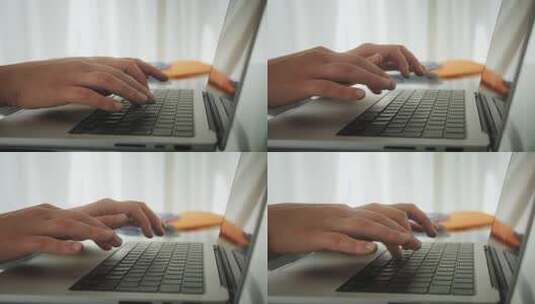人在笔记本电脑键盘上打字高清在线视频素材下载