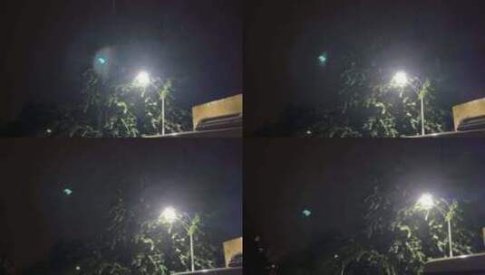 北京小区夜晚路灯下下雨高清在线视频素材下载