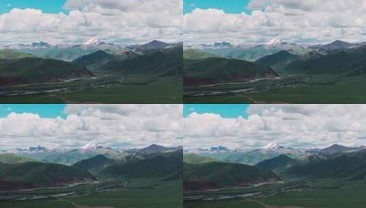 西藏那曲草原尽头巍峨的雪山航拍高清在线视频素材下载