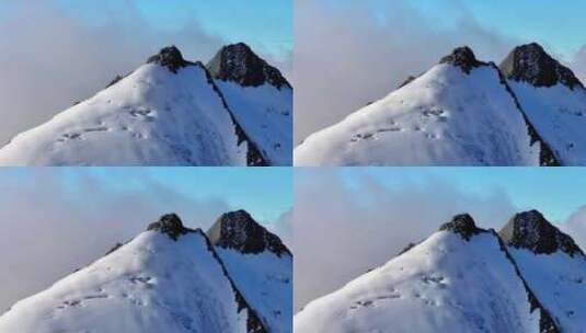 航拍攀登横断山脉乌库楚雪山山脊上的登山者高清在线视频素材下载