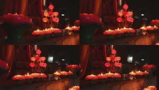 佛前供奉的莲花状蜡烛高清在线视频素材下载