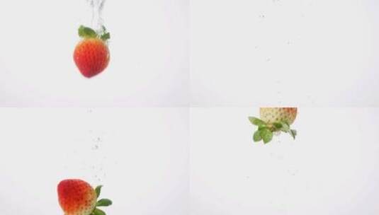 一颗草莓入水的升格特写镜头高清在线视频素材下载