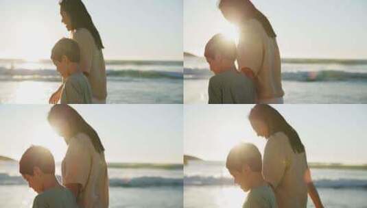爱，沙滩或日落时与母亲和儿子一起在海边的高清在线视频素材下载