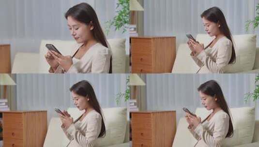 居家美女沙发上看手机高清在线视频素材下载