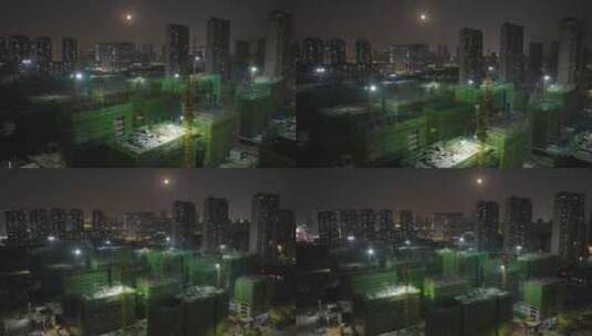 城市大楼建设建筑工地塔吊夜间航拍高清在线视频素材下载