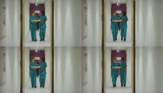 两名医务人员走过走廊高清在线视频素材下载