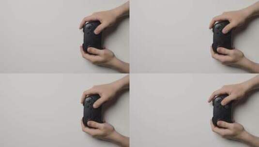 头顶拍摄的手玩游戏控制器特写高清在线视频素材下载