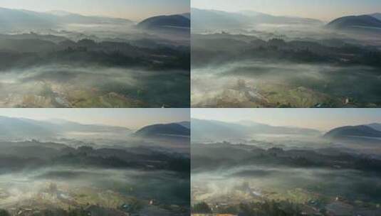 早晨云雾缭绕中的乡村大地高清在线视频素材下载