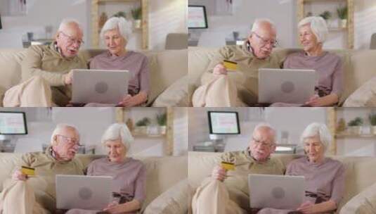退休夫妻坐在沙发上网购高清在线视频素材下载