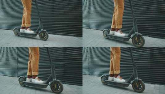 城市中骑滑板车的人高清在线视频素材下载