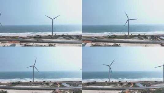 海边的风力发电风车和公路航拍高清在线视频素材下载