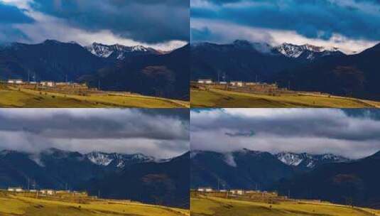 雪山下藏族村落云层延时摄影高清在线视频素材下载