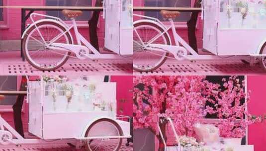 卖花文艺自行车浪漫三轮卖车花车粉色高清在线视频素材下载