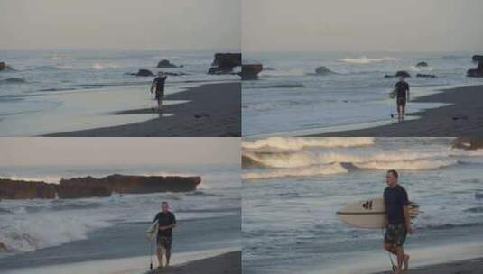海滩上行走的冲浪者高清在线视频素材下载