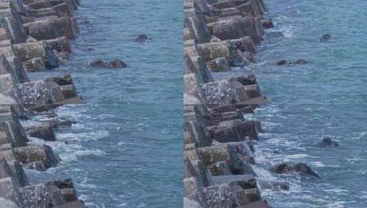 海浪拍打海边防护堤坝高清在线视频素材下载