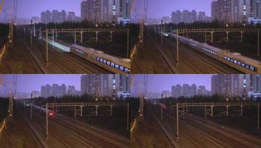 夜间高铁动车火车快速行驶火车穿过城市高清在线视频素材下载