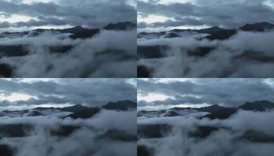 清晨航拍川西甘孜稻城亚丁云雾缭绕高山风景高清在线视频素材下载