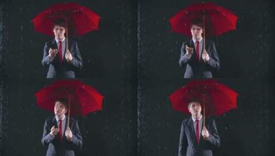男人打着红伞独自在雨中高清在线视频素材下载