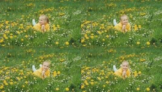 可爱的女孩躺在黄花丛里高清在线视频素材下载