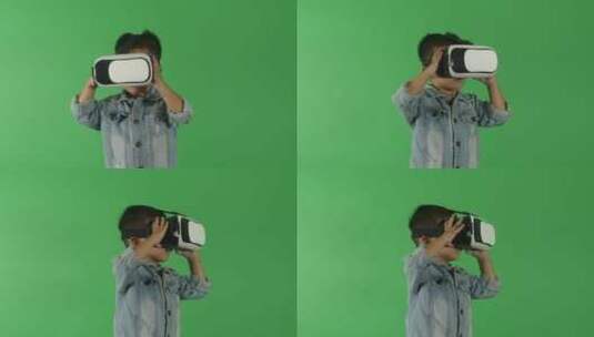 小男孩在绿幕背景前感受VR眼镜高清在线视频素材下载