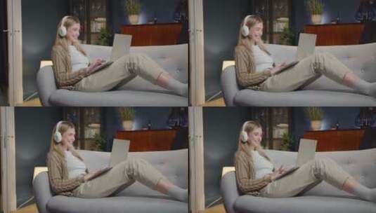 女人躺下沙发上玩电脑高清在线视频素材下载
