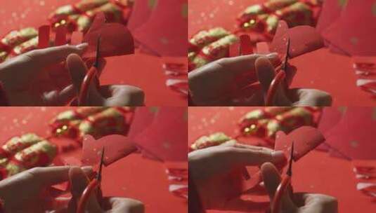 亚洲中国母子春节剪纸剪窗花红纸高清在线视频素材下载