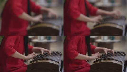 红衣女子弹奏古筝高清在线视频素材下载