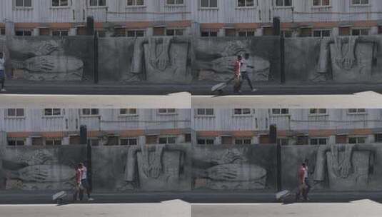 古巴哈瓦那街道行人美术墙地拍高清在线视频素材下载