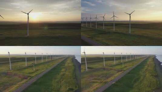 航拍用于生态供电的风力涡轮机风力发电日出高清在线视频素材下载