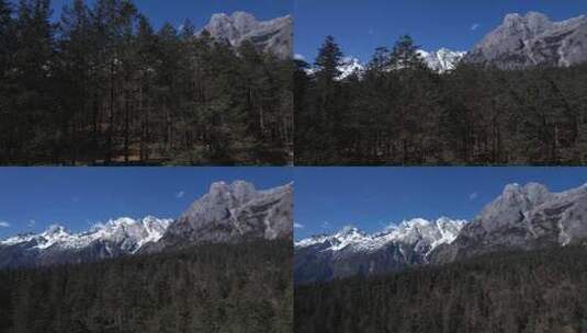 航拍山林后面的雪山高清在线视频素材下载