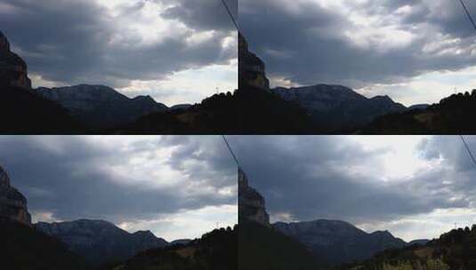 阳光穿过群山照射到Tymfi山脉上，广角镜头，延时拍摄。高清在线视频素材下载