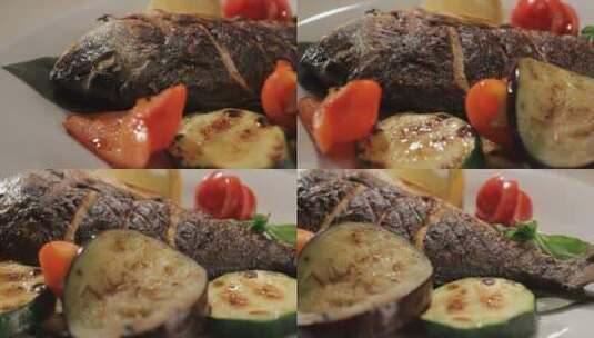 盘子上用蔬菜装饰的大鱼高清在线视频素材下载