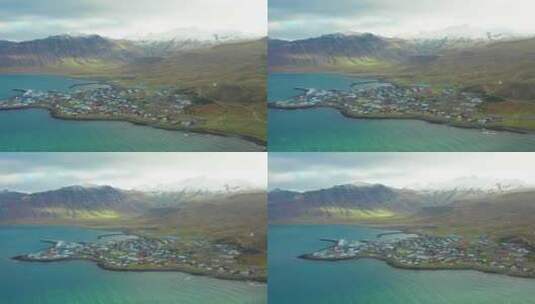 多莉从冰岛雪山环绕的Grundarfjordur村庄上空离开高清在线视频素材下载