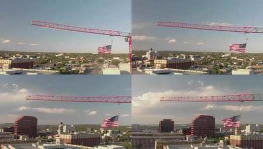 大型美国国旗城市建筑起重机的旋转天线高清在线视频素材下载