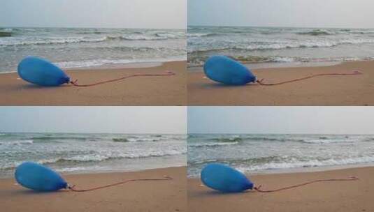沙滩上的蓝色气球与海浪 4K高清在线视频素材下载